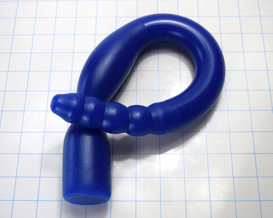 1.35-inch diameter, 18-inch blue silicone colon tube with Tip A design and 1.75-inch flange, shown on a grid background. piece coiled