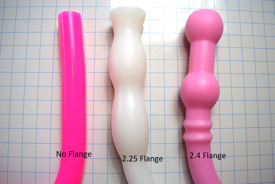 Comparison of 1.6-inch diameter silicone colon tube flange options, including no flange, 2.25-inch flange, and 2.4-inch flange designs on a grid background