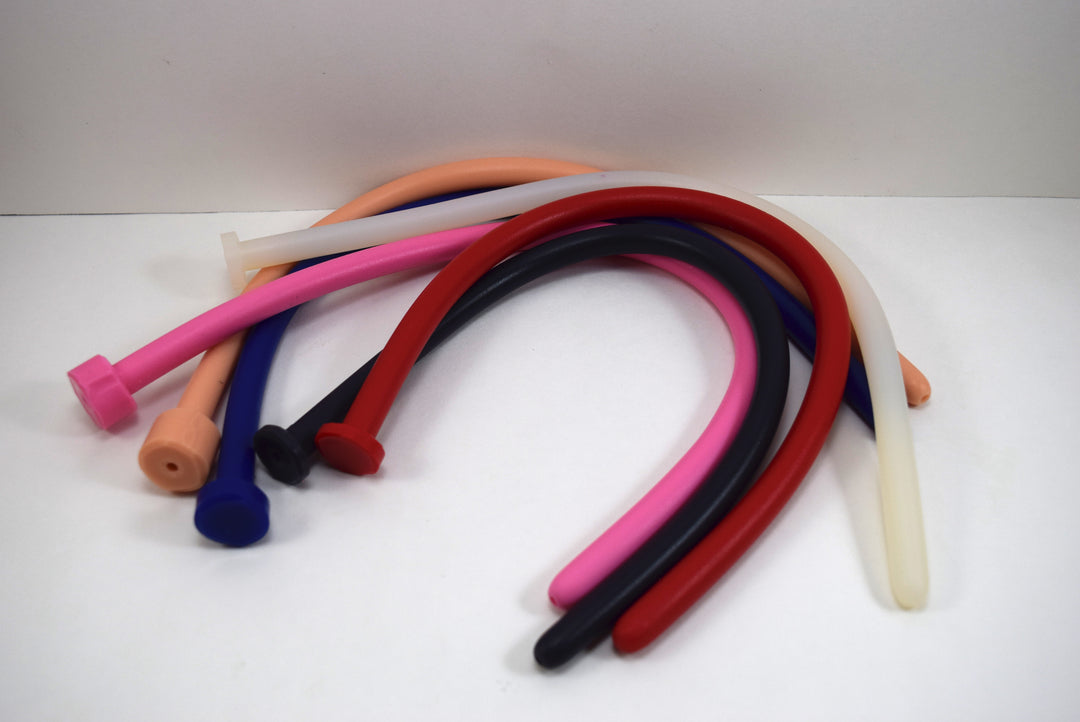Assorted colorful 11mm 33 French ball tip silicone sound probes with polished shafts and safety flanged bases.
