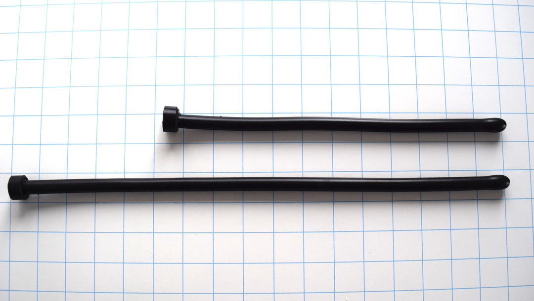 Two black 11mm 33 French ball tip silicone sound probes shown in different lengths on a grid background.