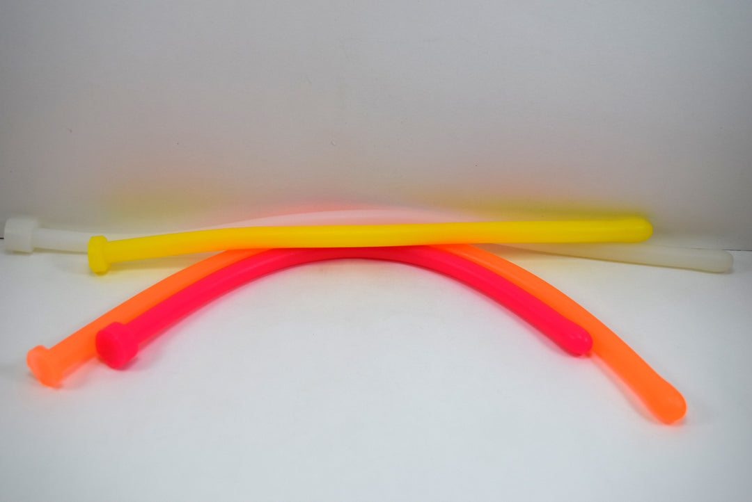 Flexible yellow, red, and green 11mm 33 French ball tip silicone sound probes coiled on a white background.