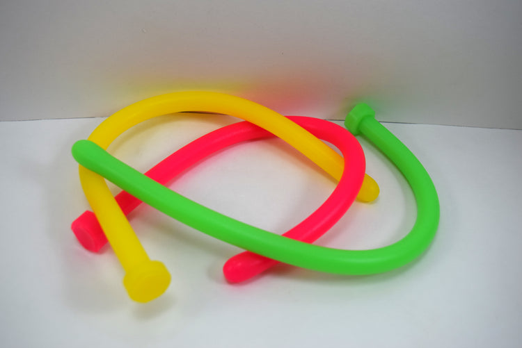 Flexible yellow, red, and green 11mm 33 French ball tip silicone sound probes coiled on a white background.