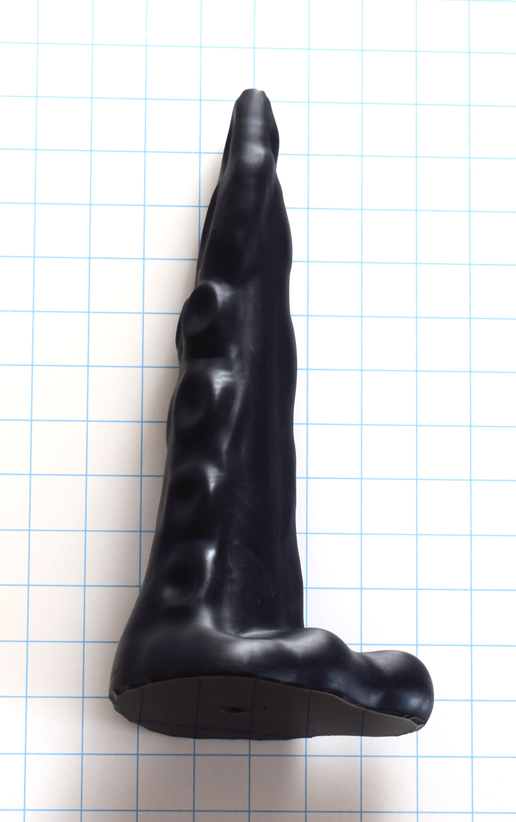Side profile view of the 12-inch large black silicone tentacle nozzle highlighting its tapered organic shape and flared base.
