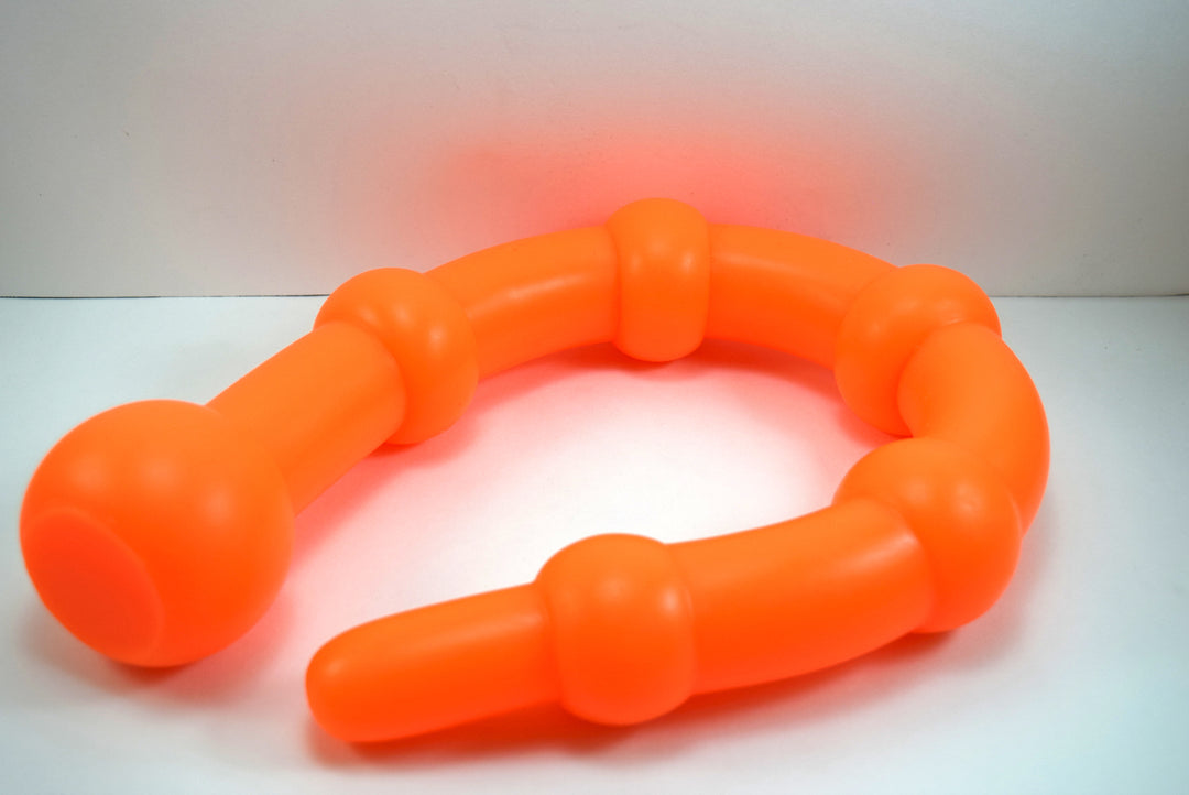 26 inch colon ball flexible silicone colon nozzle laid out in a curve showing progressive sphere diameters from entry tip to base.