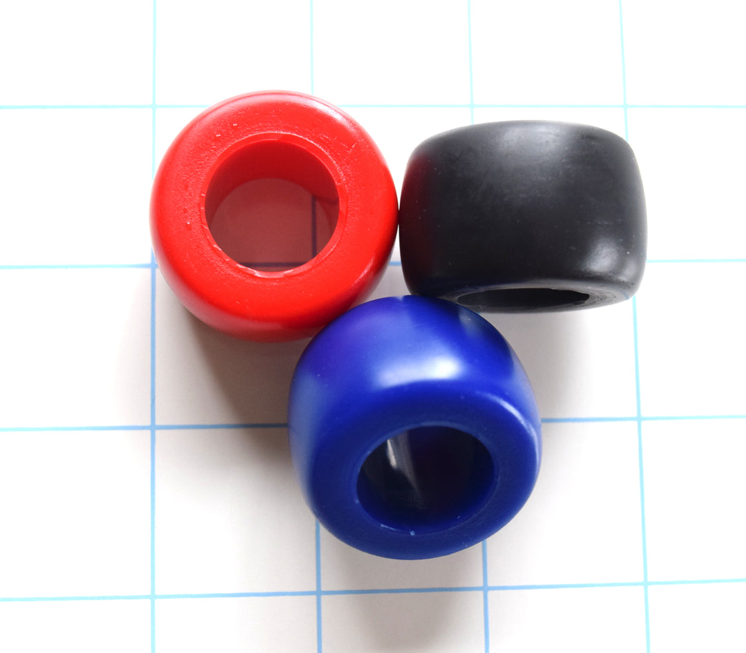Erection Stamina Ring Medium 3/4-inch inside diameter silicone sensory ring, 0.75-inch wide, 0.3-inch thick, available in multiple softness levels and colors on a blue grid background.