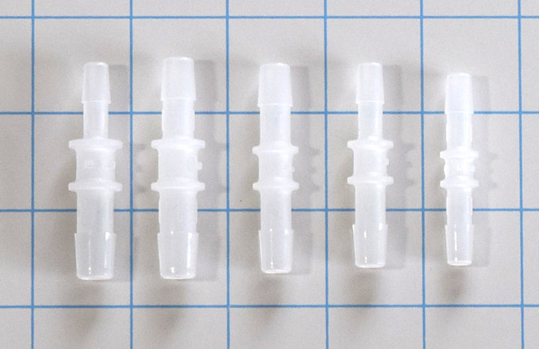 Five white plastic straight barbed hose connectors in 1/4 inch, 5/16 inch, and 3/8 inch sizing combinations on a blue grid background.