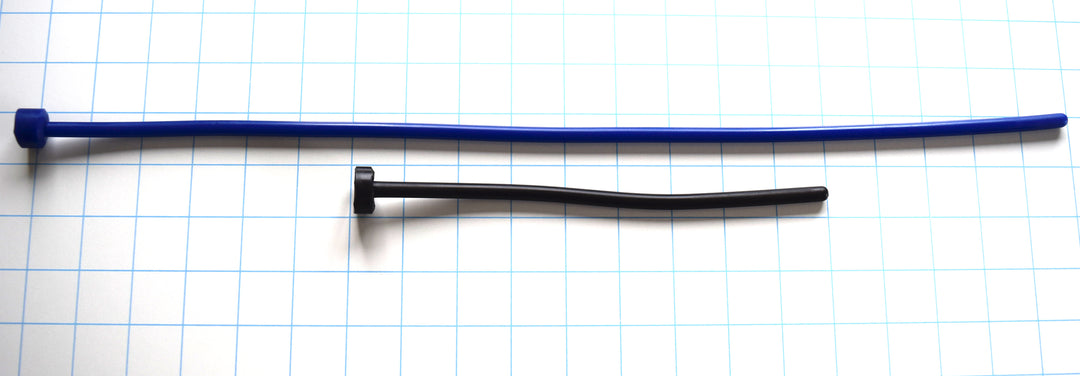  SSND-7mm extra-long urethral sound with polished rounded tip, 7mm diameter, 21 French, available in 8-inch and 18-inch insertable lengths
Side-by-side comparison of 8-inch and 18-inch SSND-7mm urethral stretching probes on a grid background, highlighting the flexible silicone design and flanged base.