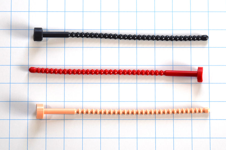Three 8mm ribbed flexible silicone urethral sounds in black, red, and flesh arranged horizontally on a grid background.