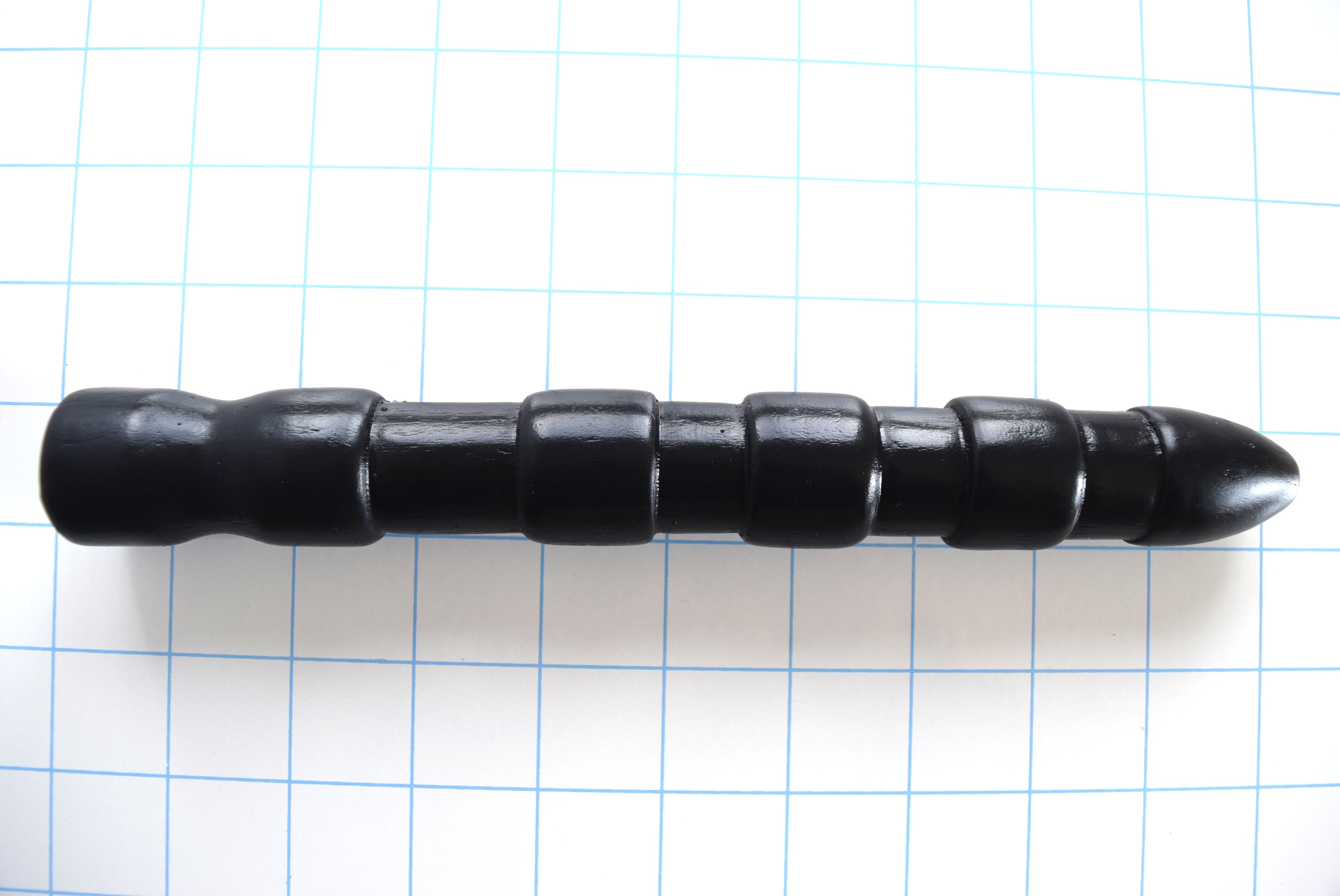 9-inch aggressive ribbed silicone shooter nozzle with bulbous tip and multi-ribbed stimulation design