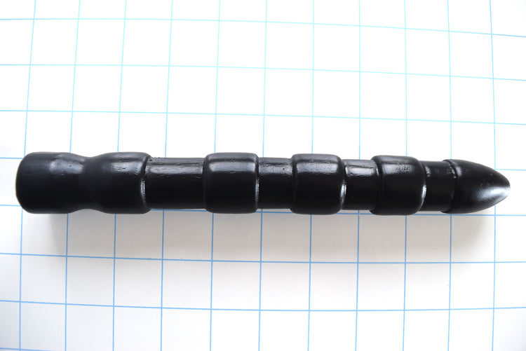 9-inch aggressive ribbed silicone shooter nozzle with bulbous tip and multi-ribbed stimulation design