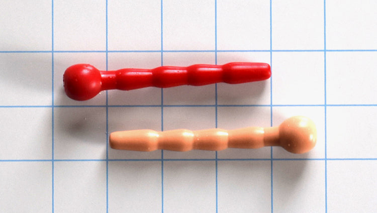 cntrd3 catheter, 3 inches long, max diameter of 9.5mm, 8mm flange, ball flange, 2 pieces, one red, one flesh colored, on a white background with blue 1"x1" grid