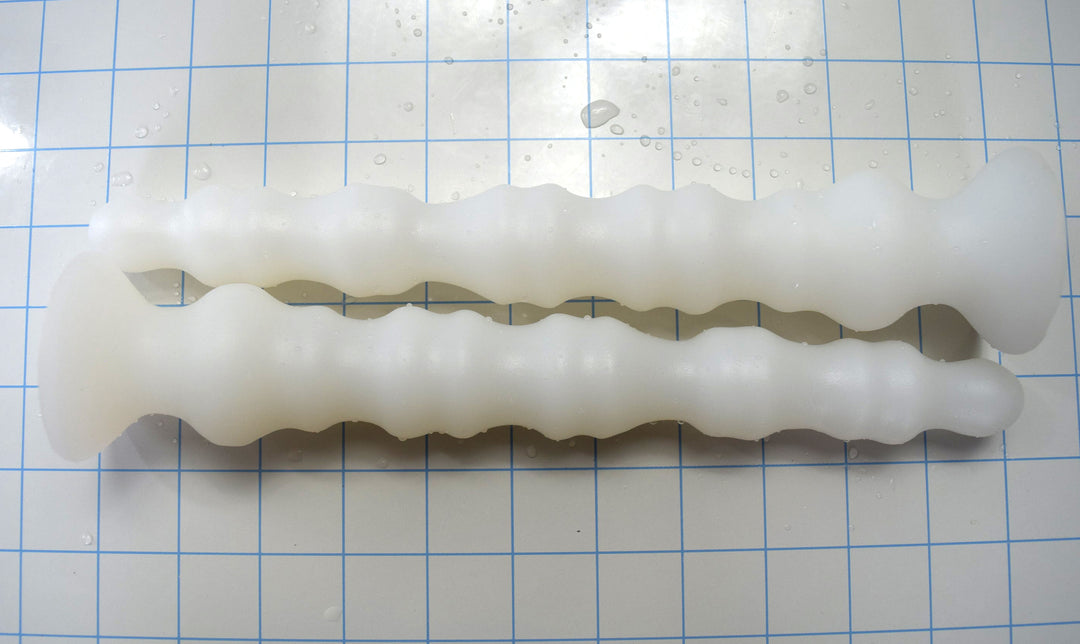 Multi-dimensional enhanced rib silicone enema nozzle with graduated ribbed texture and flared safety base, 10.5 inches long