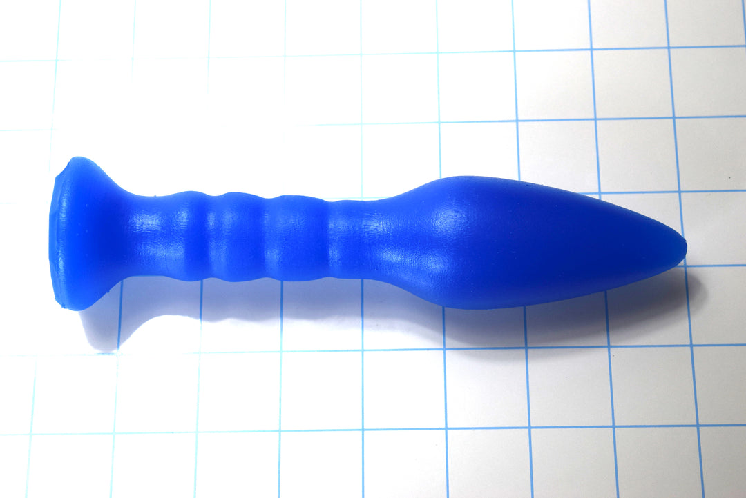 SPD1.6 ribbed extended silicone retention nozzle with 1.6-inch diameter, 7.5-inch length, tapered tip, and four graduated ribs with wide flange base