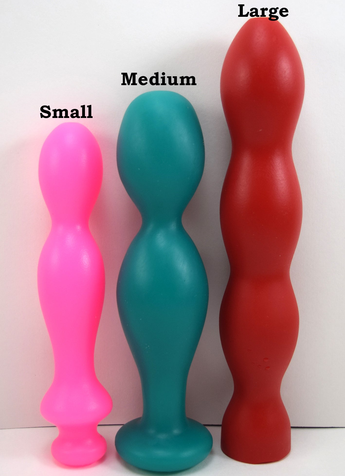 Silicone ball tip nozzle family including small, medium, and large sizes, showing variation in bulb shape and length on a white background