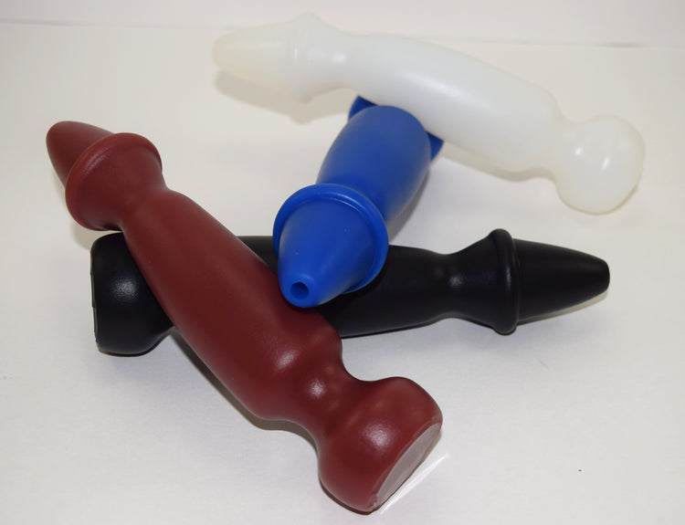 Four Bishop 8-inch silicone enema nozzles in brown, black, blue, and translucent white arranged in a cluster, featuring a tapered expanded ring tip and flanged base.