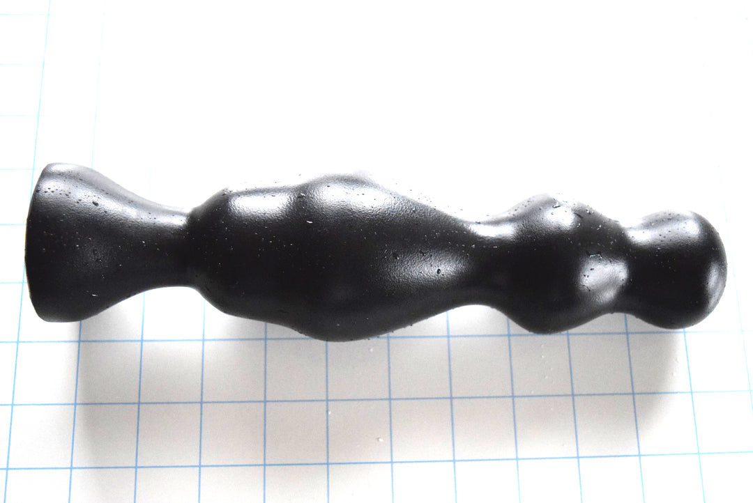 Bulbous 2 multi-staged black silicone retention nozzle showcasing its graduating 1.95-inch tip, 2.2-inch secondary bulb, 2.7-inch main peak, and 1.2-inch retention neck on a grid background