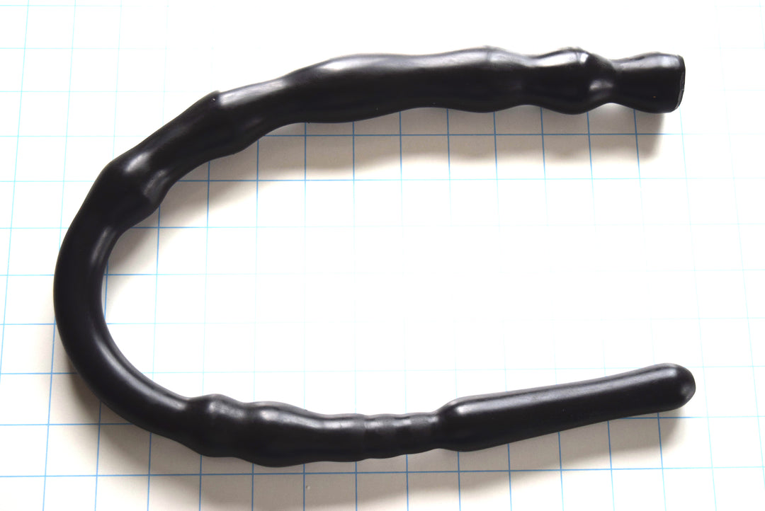 Bulbous Tip 27-inch Multi-Ball enema colon tube in solid black silicone on a blue grid background, showcasing its 0.9-inch bulbous tip, smooth 5-inch mid-section, and 1.4-inch rear bump clusters.