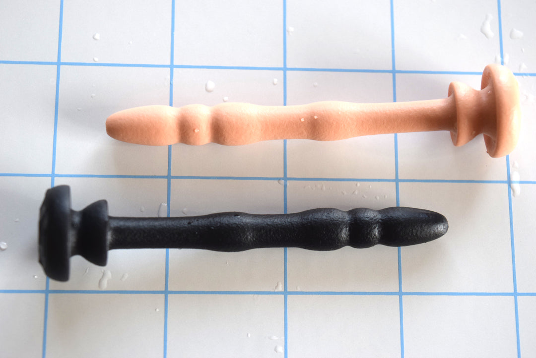 SSND-Chastity 8-9mm urethral sound showing 5mm rounded tip, graduated ribs, and retention grooves for CB-6000 and CB-3000 devices