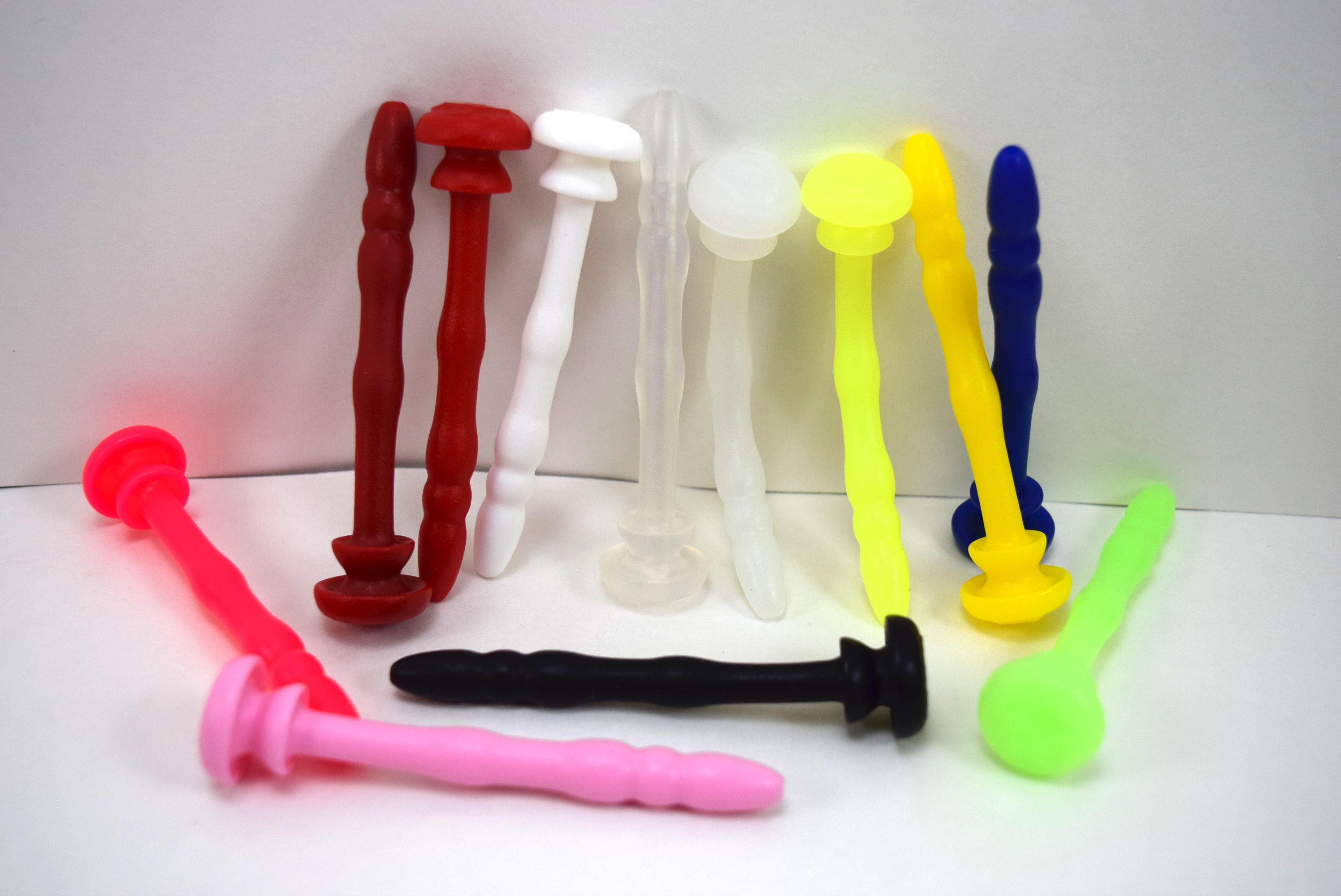 SSND-Chastity 8-9mm urethral sound showing 5mm rounded tip, graduated ribs, and retention grooves for CB-6000 and CB-3000 devices