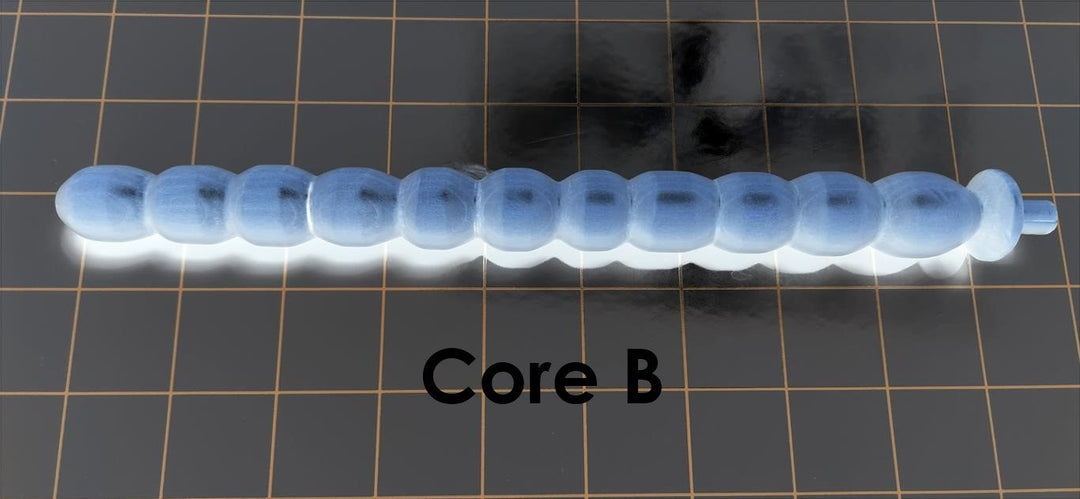 Core B solid mold insert showing 11 ball and rib segments designed to shape inner channels for silicone stimulation sleeves.