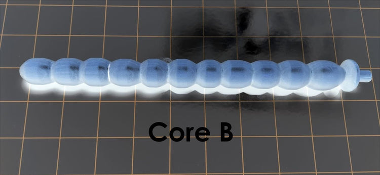 Core B solid mold insert showing 11 ball and rib segments designed to shape inner channels for silicone stimulation sleeves.