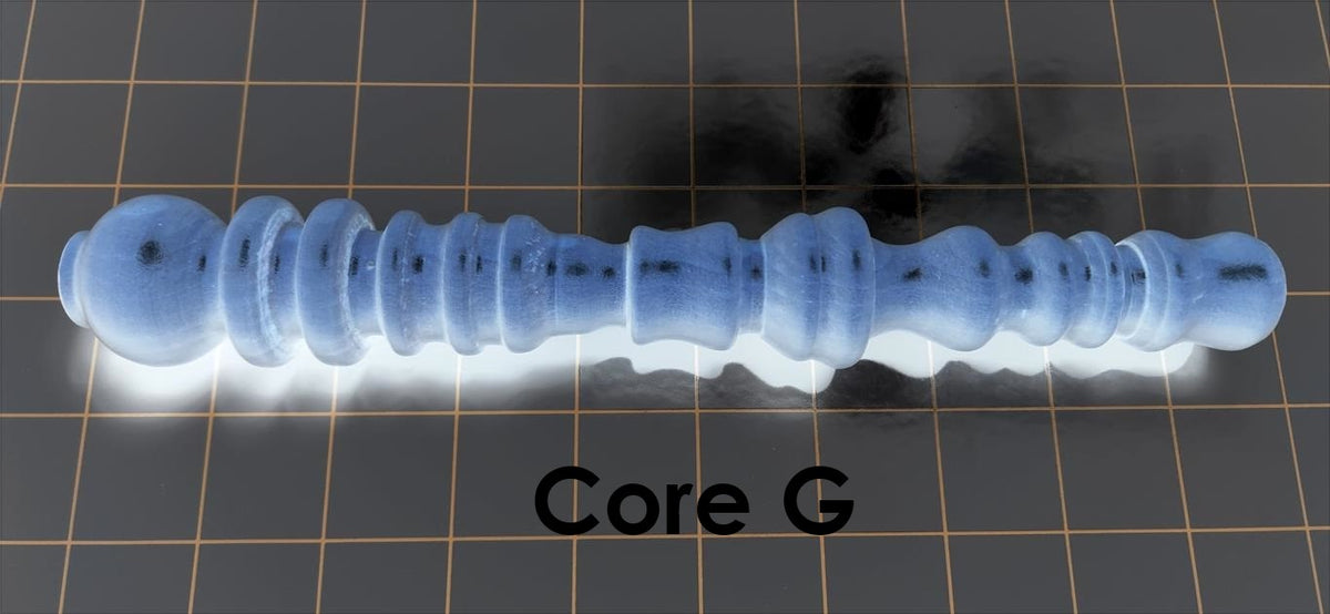 Core G solid mold insert featuring aggressive ribs, bumps, and fluted suction pockets designed for high-stimulation silicone enhancement sleeves.