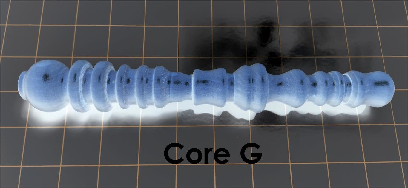 Core G solid mold insert featuring aggressive ribs, bumps, and fluted suction pockets designed for high-stimulation silicone enhancement sleeves.