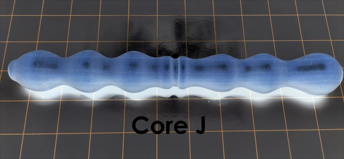 Core J solid mold insert featuring long smooth gripping ribs, wide pockets, and a compact ribbed suction section for silicone enhancement sleeves.