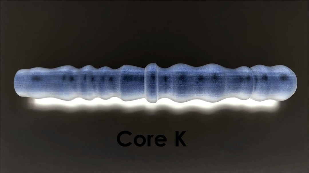 Core K large-diameter solid mold insert featuring prominent ribs and bumps designed for high-stimulation silicone enhancement sleeves.