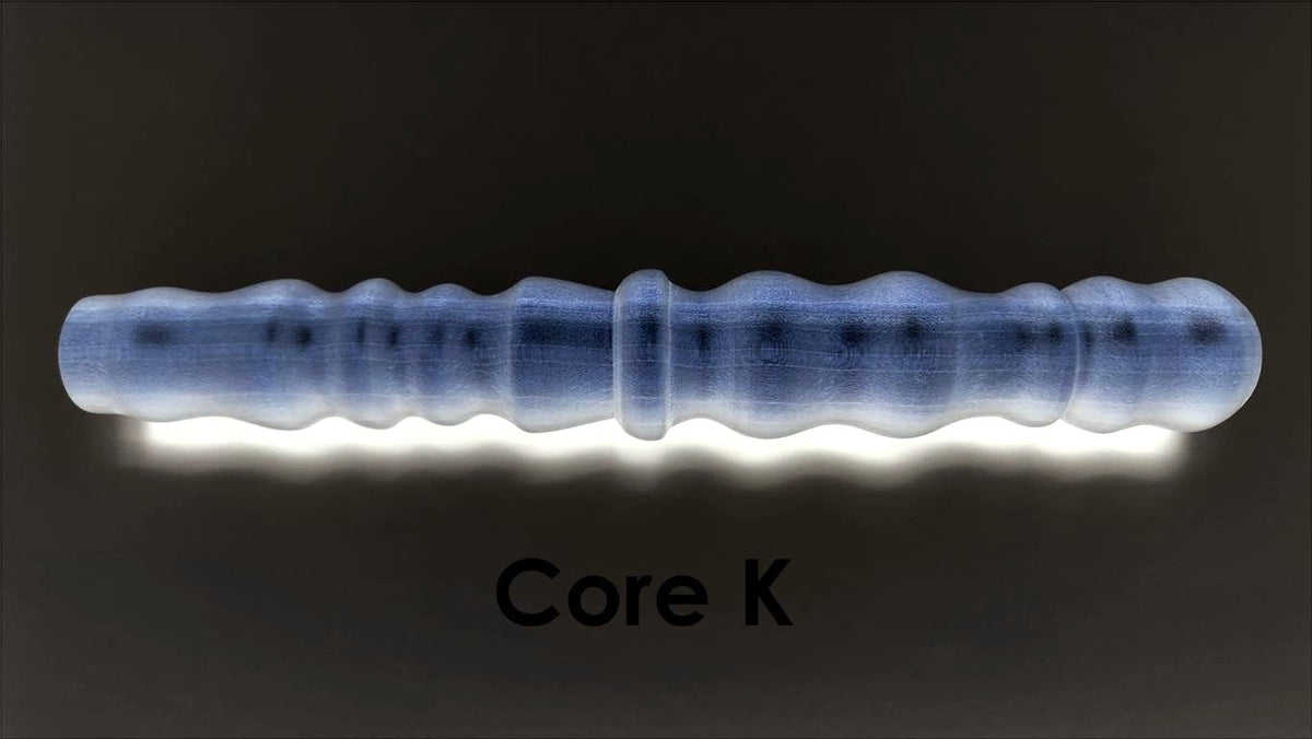 Core K large-diameter solid mold insert featuring prominent ribs and bumps designed for high-stimulation silicone enhancement sleeves.