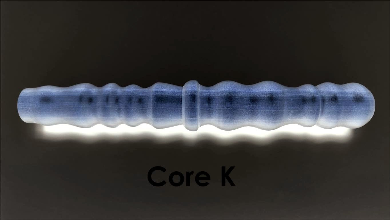 Core K large-diameter solid mold insert featuring prominent ribs and bumps designed for high-stimulation silicone enhancement sleeves.