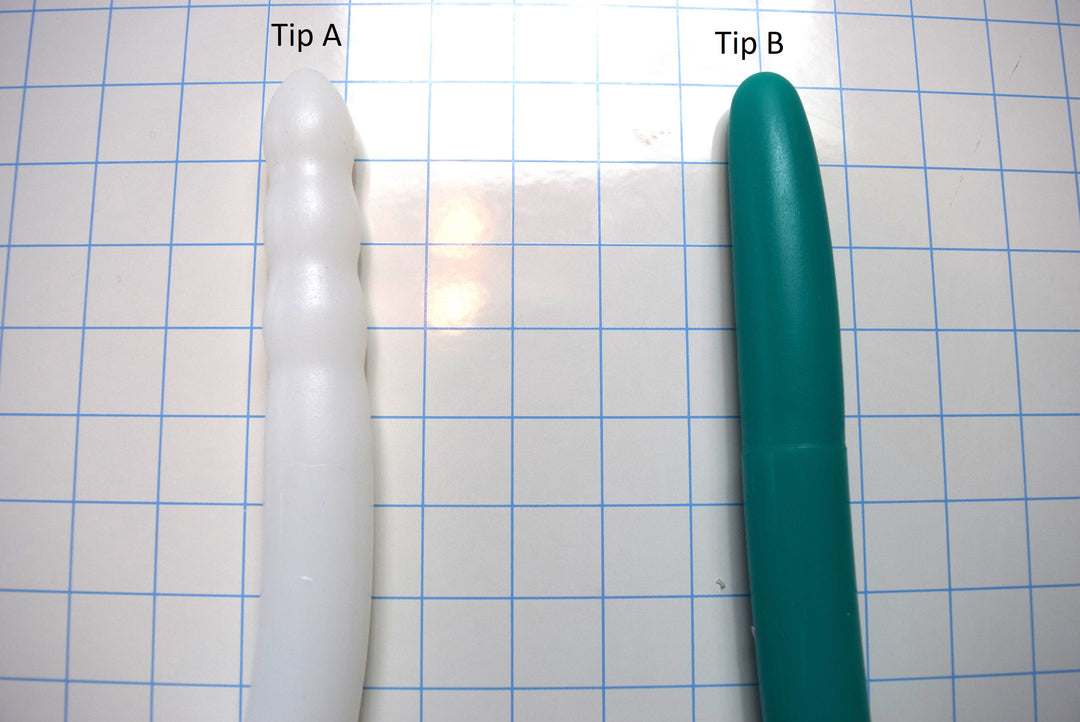 Deep Throat Training silicone oral trainer tip options showing textured Tip A on the left and smooth tapered Tip B on the right.
