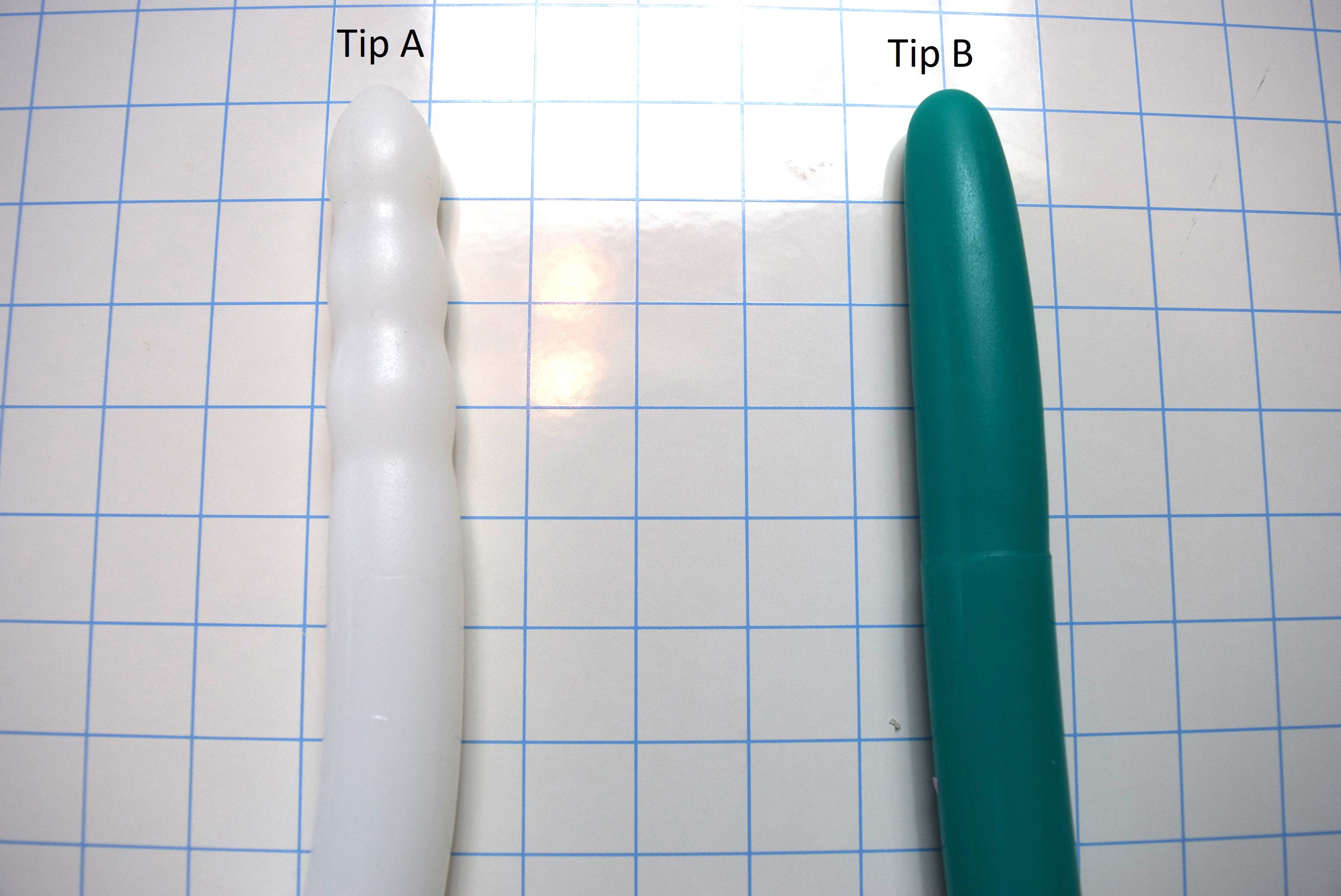 Deep Throat Training silicone oral trainer tip options showing textured Tip A on the left and smooth tapered Tip B on the right.