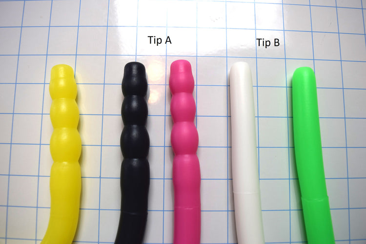 Deep Throat Training tube tips showing smooth and ribbed anatomical tip options Tip A and Tip B on a blue grid background