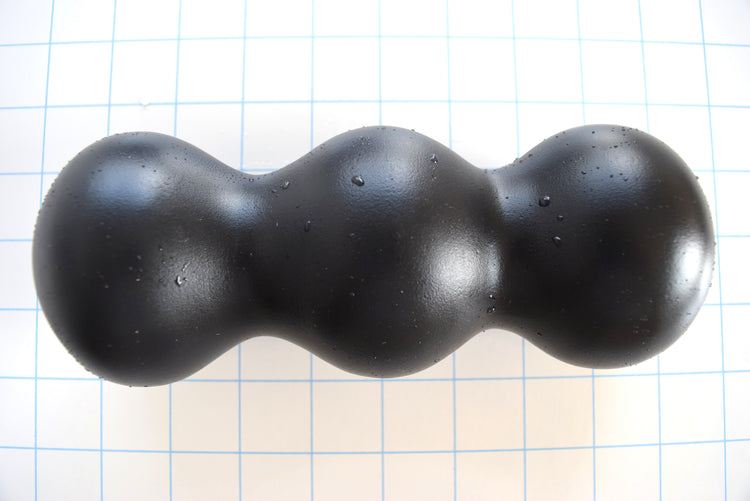 ED-ESS 4 7.5-inch oversized triple ball enhancement sleeve with a 2.85-inch ball diameter, 1.85-inch valley areas, and customizable inner core options on a grid background.