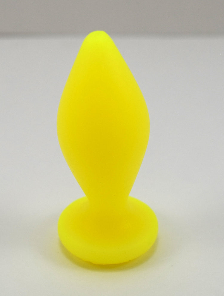 Expanded Diamond 1-inch fluorescent yellow silicone retention nozzle featuring a wide faceted diamond body, 2-inch insertable length, ultra-slim retention valley, and flat safety flange on a grid background.