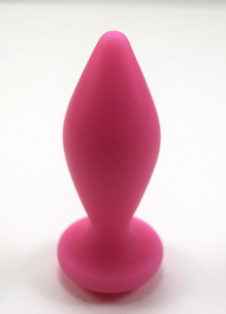 Expanded Diamond 1-inch pink silicone retention nozzle featuring a wide faceted diamond body, 2-inch insertable length, ultra-slim retention valley, and flat safety flange on a grid background.