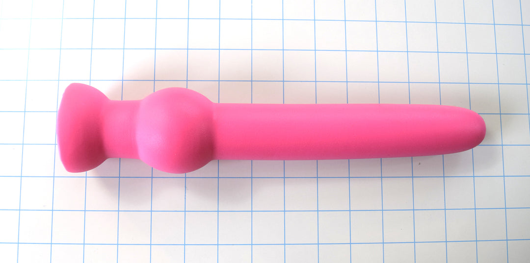 GRB 122 12-inch smooth silicone retaining ball colon nozzle featuring a 1.6-inch shaft diameter, 11-inch insertable depth, 2.4-inch retention ball, and flared safety base flange on a blue grid background.