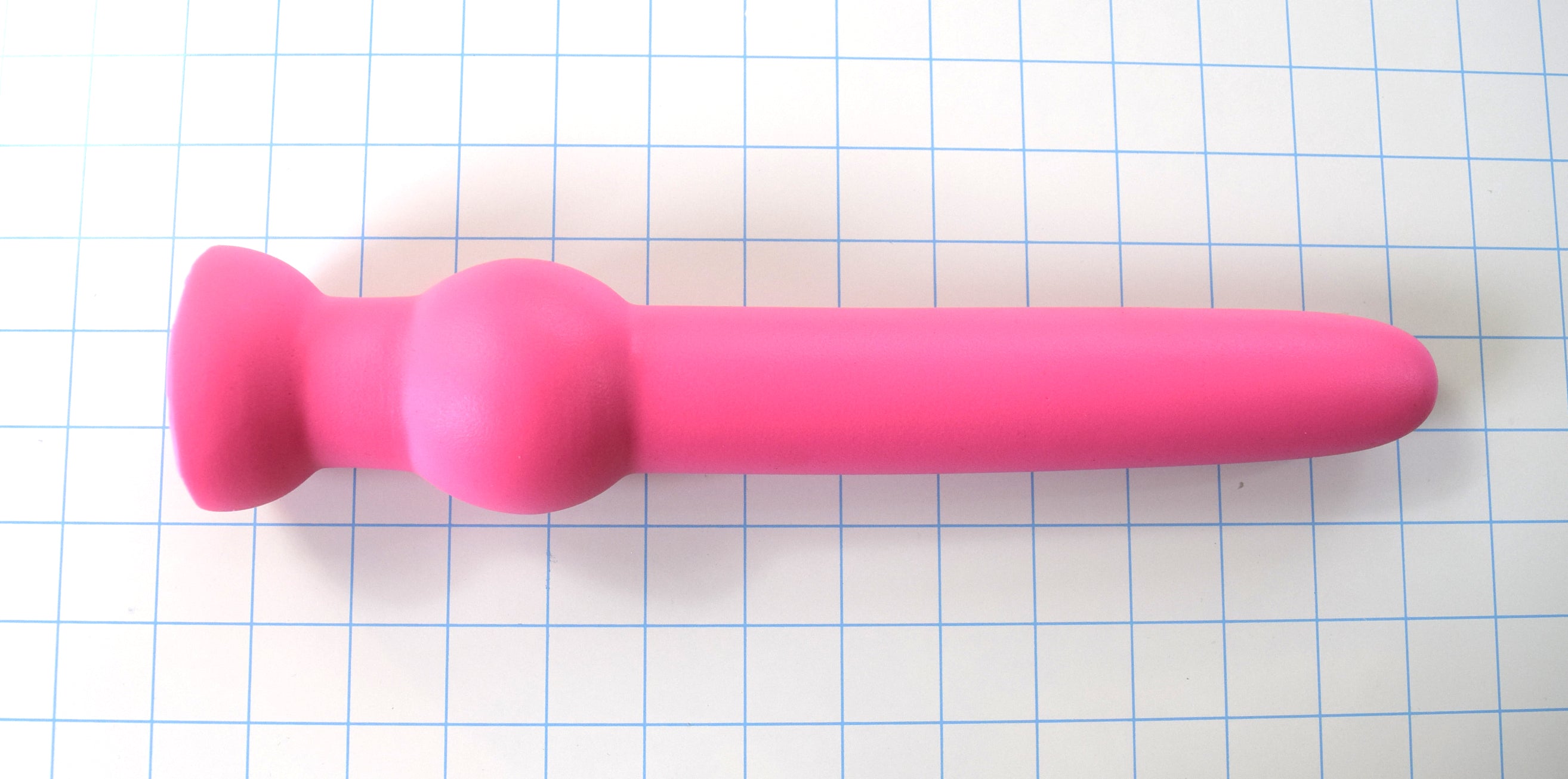GRB 122 12-inch smooth silicone retaining ball colon nozzle featuring a 1.6-inch shaft diameter, 11-inch insertable depth, 2.4-inch retention ball, and flared safety base flange on a blue grid background.