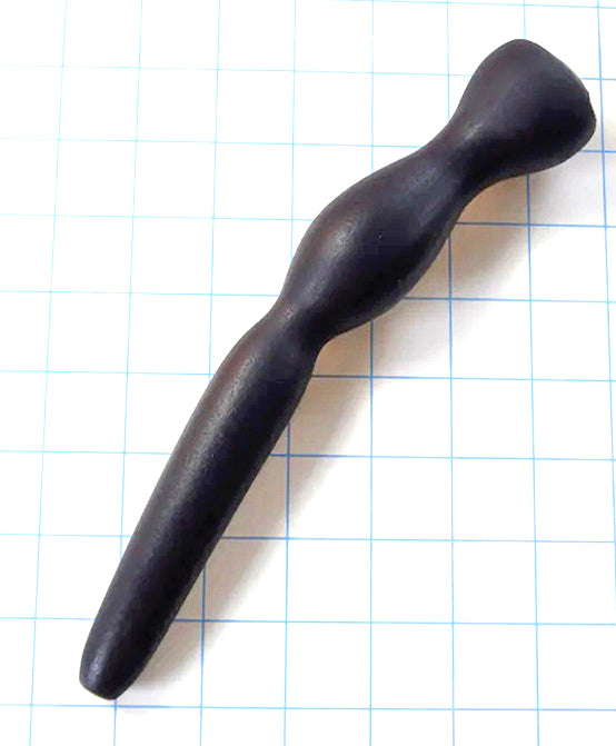 GRB 35 9-inch silicone colon nozzle featuring a 4.5-inch tapered entry tip, 1.4-inch elliptical expansion ball, dual retention valleys, and a 1.5-inch safety flange base on a blue grid background.