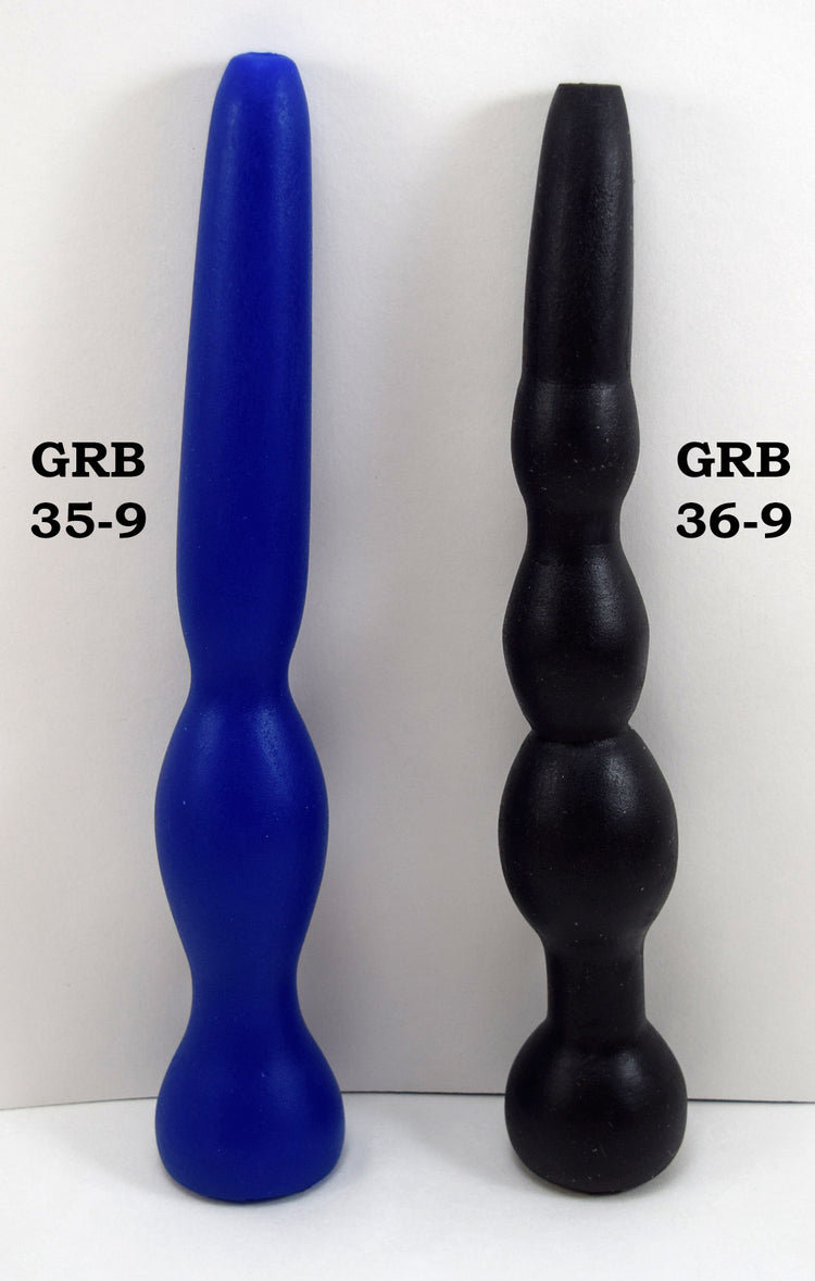 GRB35-9 and GRB 36-9 silicone colon nozzles side-by-side comparison on a grid background showing the blue GRB 35 elliptical expansion model and the black GRB 36 multi-bulb segmented model.