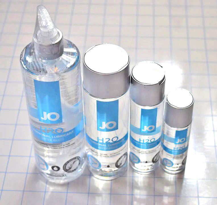 Group shot showing 2 oz, 4 oz, 8 oz, and 16 oz bottles of JO H2O water-based personal lubricant on a grid background.
