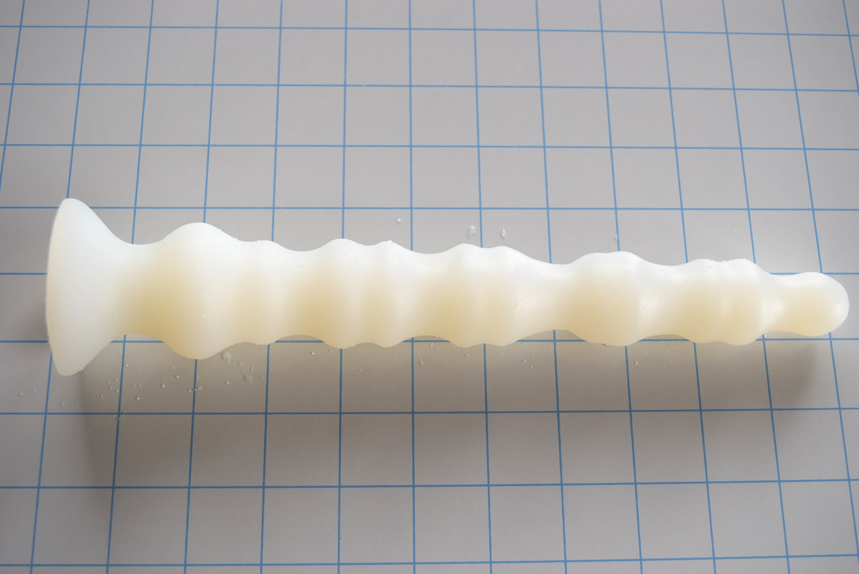 Multi-dimensional enhanced rib silicone enema nozzle with graduated ribbed texture and flared safety base, 10.5 inches long