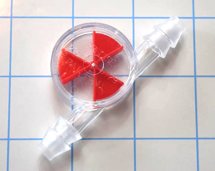 Clear inline liquid flow indicator featuring a red wagon wheel spinner paddle and double barbed ends on a blue grid background.