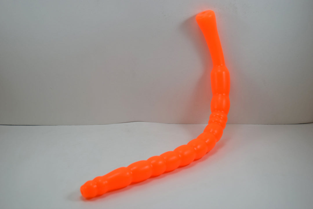 Bright orange MBXL ribbed silicone colon nozzle, showcasing its flexible, graduated design and flared base flange on a clean white background