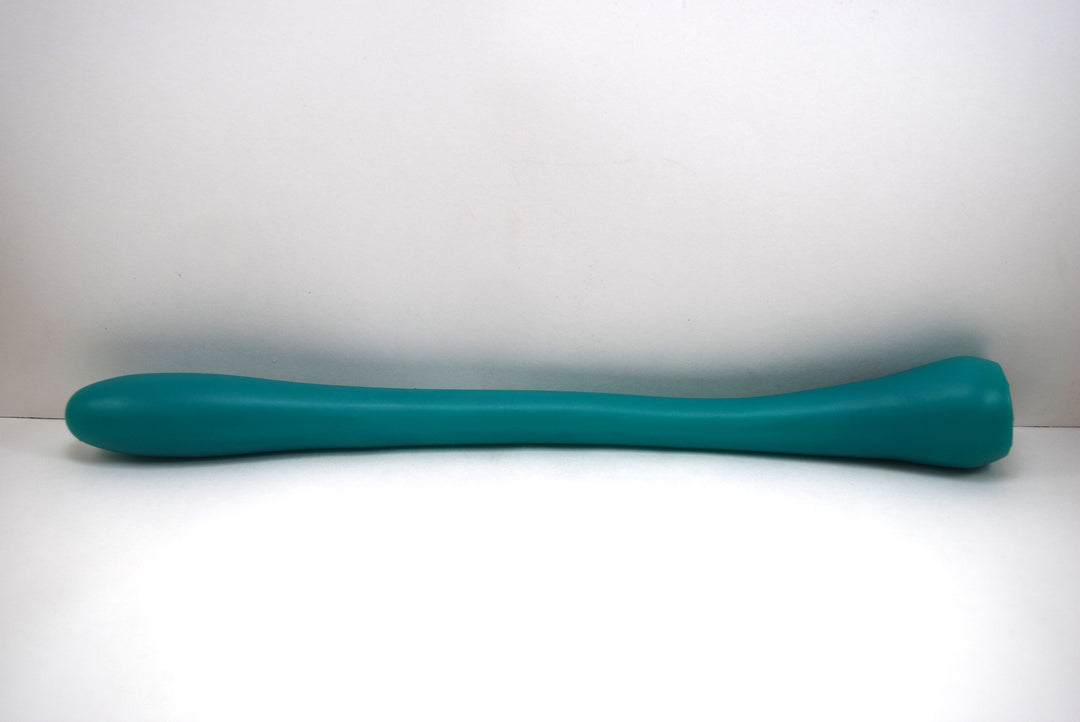 green Model N 12-inch silicone enema nozzle with a contoured oblong tip and flared base lying horizontally on a white background.