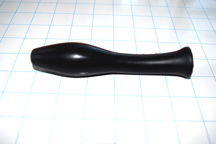 Model S black silicone enema nozzle showcasing its 6-inch total length, 1.25-inch sloped oval tip, 2.25-inch long slender mid-shaft, and 1.2-inch flared round base on a blue grid background