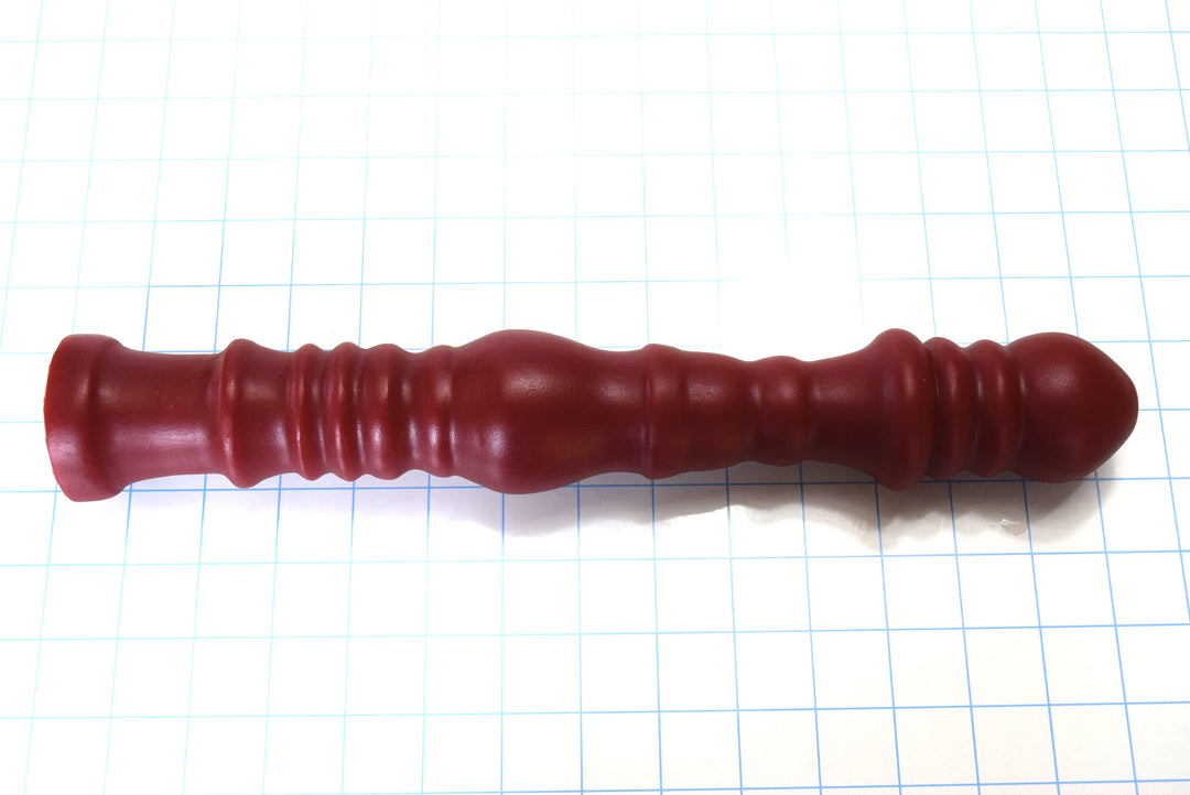 Multi-dimensional 14-inch ribbed and ball silicone enema nozzle with graduated ribs and balls for sigmoid colon delivery, featuring translucent silicone construction with flared safety base