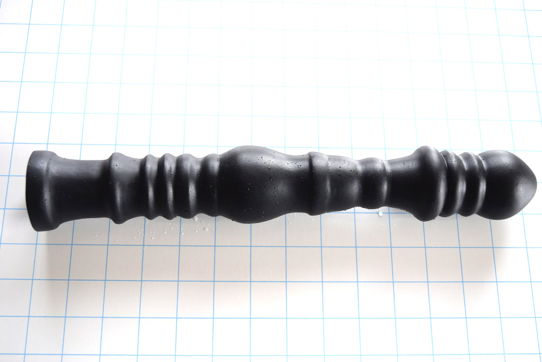 Multi-dimensional 14-inch ribbed and ball silicone nozzle with graduated design for sigmoid colon delivery, featuring a flared safety base on a white grid background