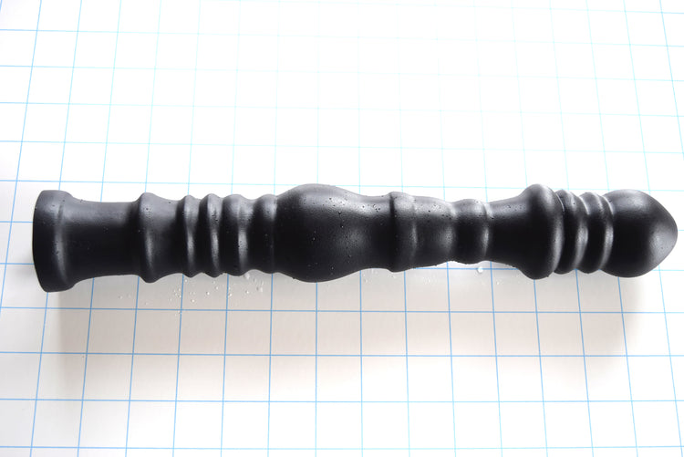 Multi-dimensional 14-inch ribbed and ball silicone nozzle with graduated design for sigmoid colon delivery, featuring a flared safety base on a white grid background